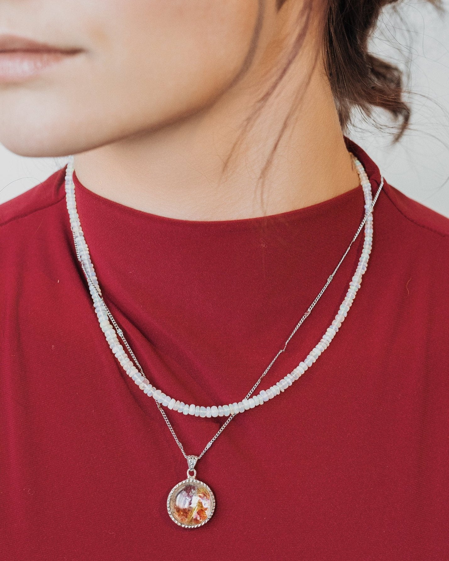 round hematoid quartz pendant in silver setting