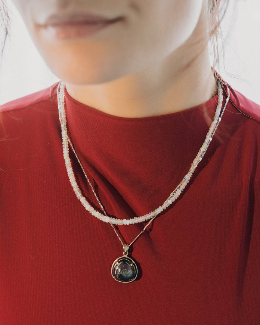 round phantom quartz pendant in silver setting