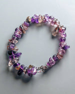 Load image into Gallery viewer, Multicolored beaded bracelet on a light gray background
