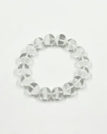 Load image into Gallery viewer, Clear beaded bracelet on a light gray background