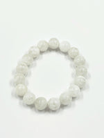 Load image into Gallery viewer, White beaded bracelet on a white background