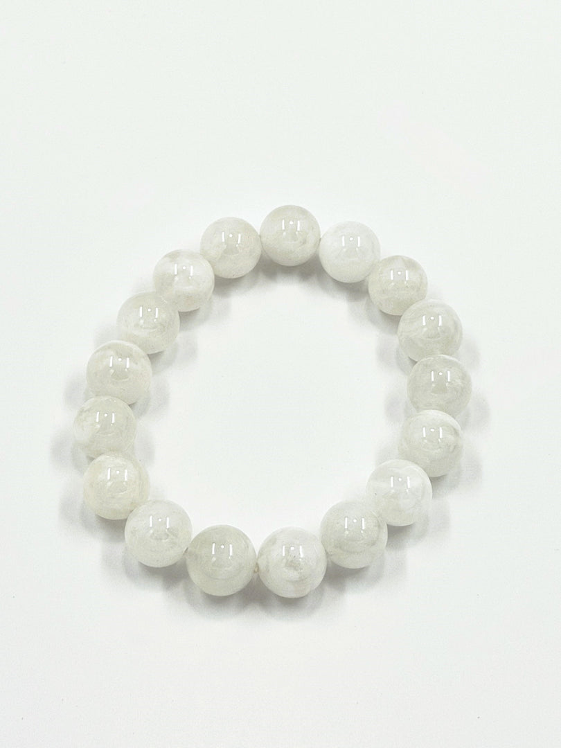 White beaded bracelet on a white background