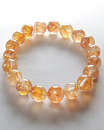 Load image into Gallery viewer, Orange beaded bracelet on a white background
