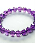 Load image into Gallery viewer, Purple beaded bracelet on a white background
