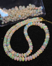 Opal bead necklace on a black background