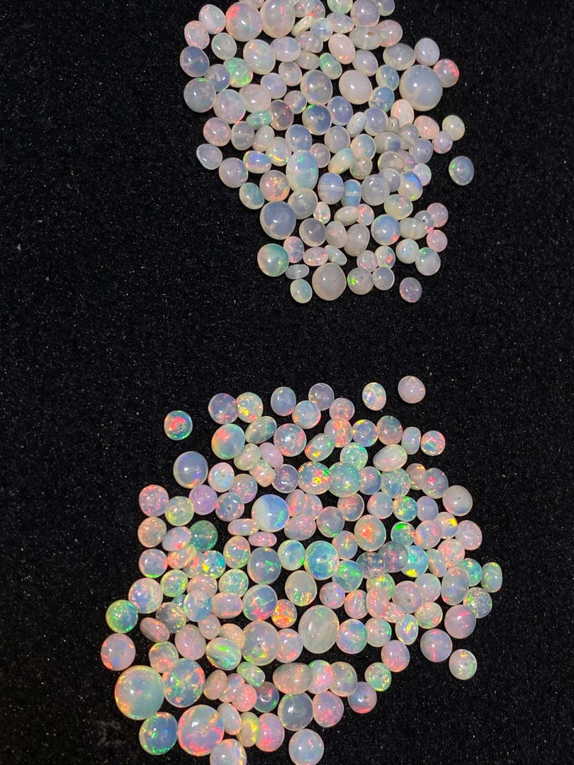Opal stones with multicolor fluorescence on a black background