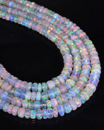 Load image into Gallery viewer, Opal beads on a black background
