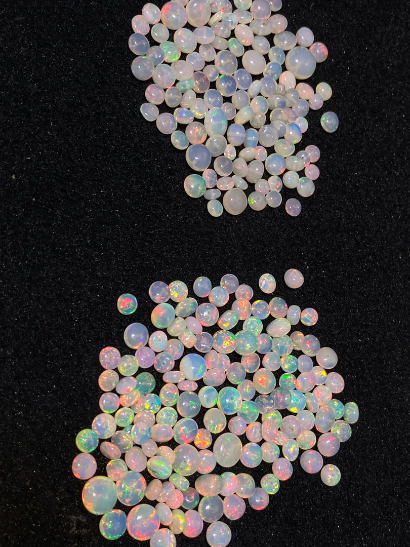 Opal stones with multicolor fluorescence on a black background