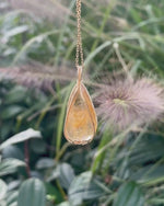 Load and play video in Gallery viewer, medium teardrop golden rutilated quartz pendant
