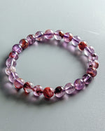 Load image into Gallery viewer, Multicolored beaded bracelet on a light gray background
